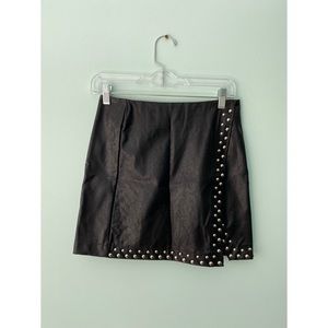 Studded leather mini skirt